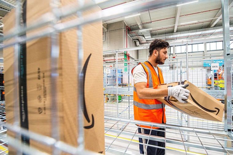 An employee works at the parcel sorting hangar during the inauguration of first Belgian delivery center of US online retail giant Amazon in Antwerp earlier this month.