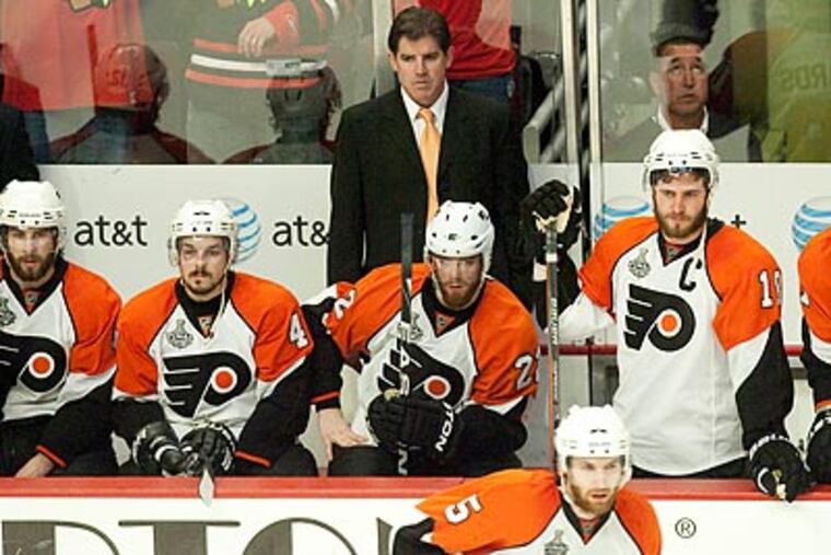Peter Laviolette had plenty of work to do on the Flyers' day off. (Ed Hille/Staff Photographer)