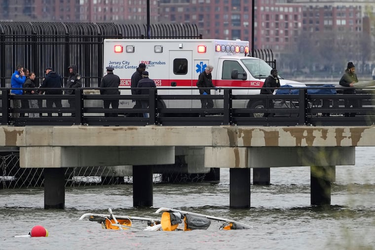 Emergency personnel respond to a helicopter crash on the Hudson River on April 10, 2025, in Jersey City, N.J.