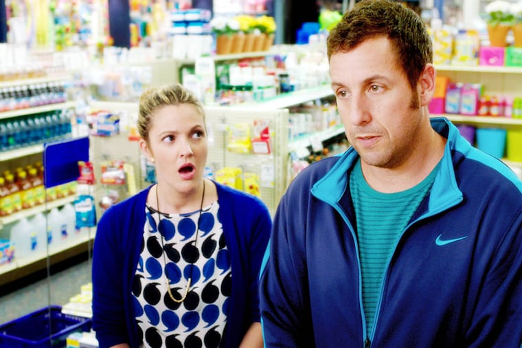 This image released by Warner Bros. Pictures shows Drew Barrymore, left, and Adam Sandler in a scene from "Blended." (AP Photo/Warner Bros. Pictures)