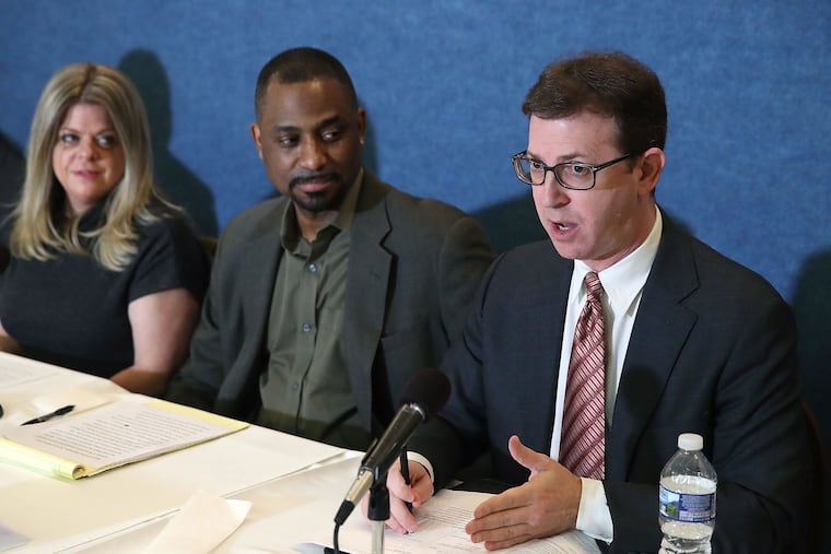 Attorney Mark Zaid (right) speaks at a news conference on March 9, 2017, in Washington, D.C. Mark Wilson/Getty Images