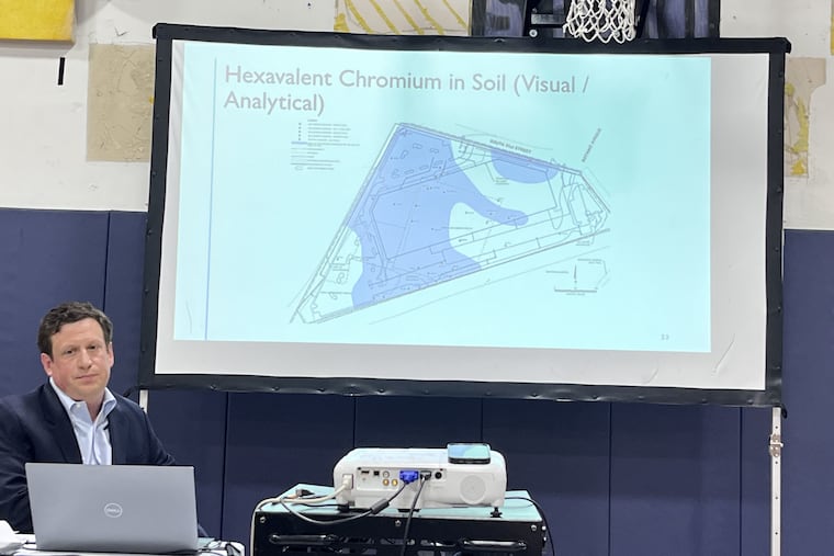 Eric Carlson, owner of Alliance 51st Street LLC, shows a slide of chromium contamination during a public presentation at Richard Allen Preparatory Charter School on May 22 about the company's property in Southwest Philadelphia.