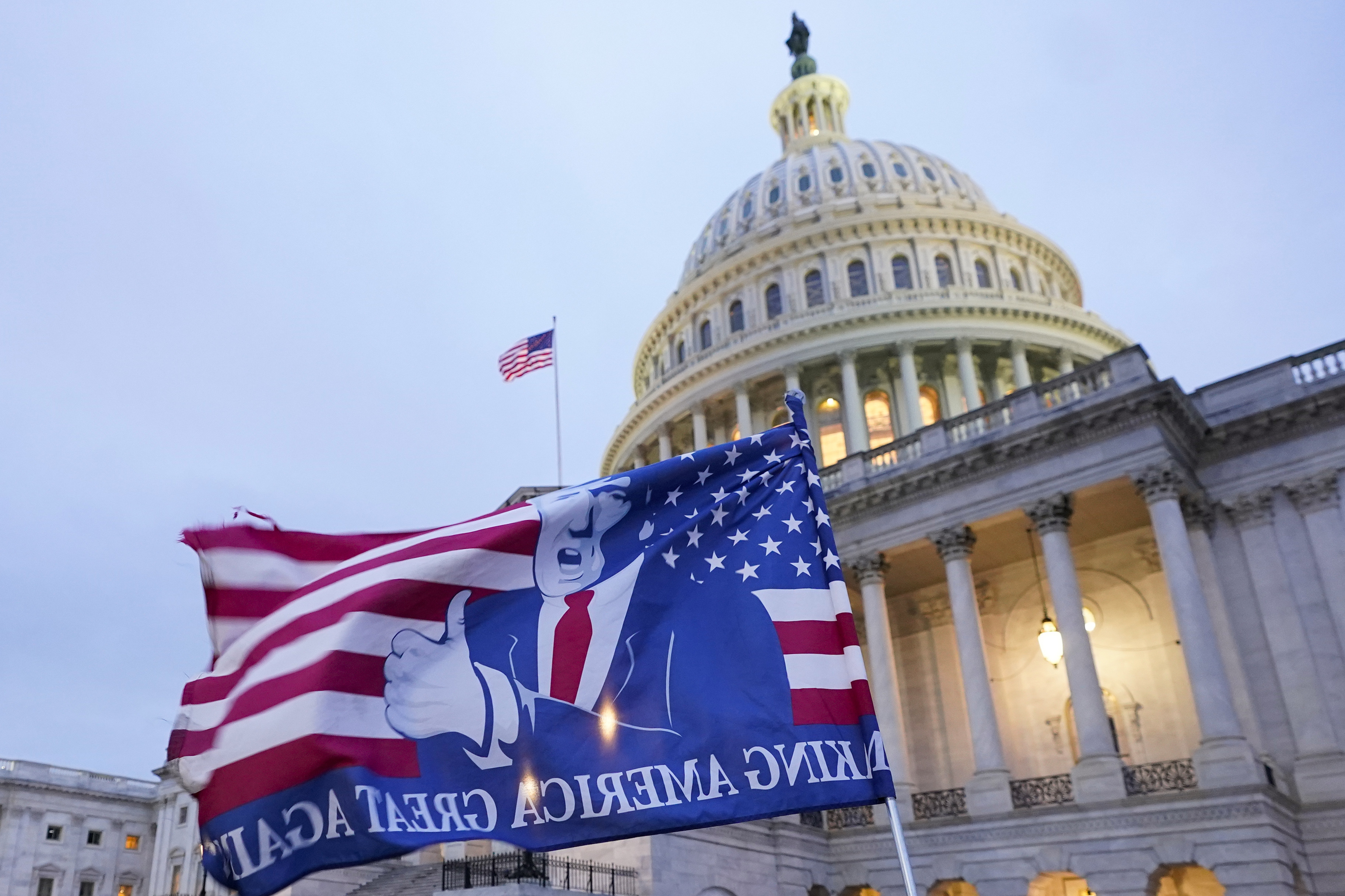 A flag depicting President Donald Trump flew on the East Front of the U.S. Capitol on Jan. 6, 2021.
