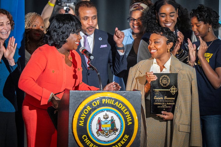 Mayor Cherelle L. Parker presents Quinta Brunson the key to the city of Philadelphia Wednesday at Andrew Hamilton Elementary School, which Brunson attended.