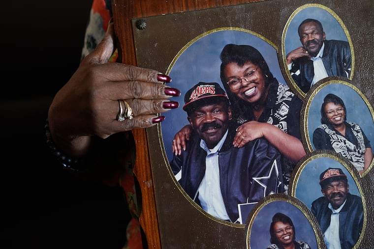 Robert Womack, seen in a portrait held by JoeAnn Luck, was shot and killed in January 2020. The teenager police say pulled the trigger, Zhafir Tinsley-Jones, has been cleared in the case.