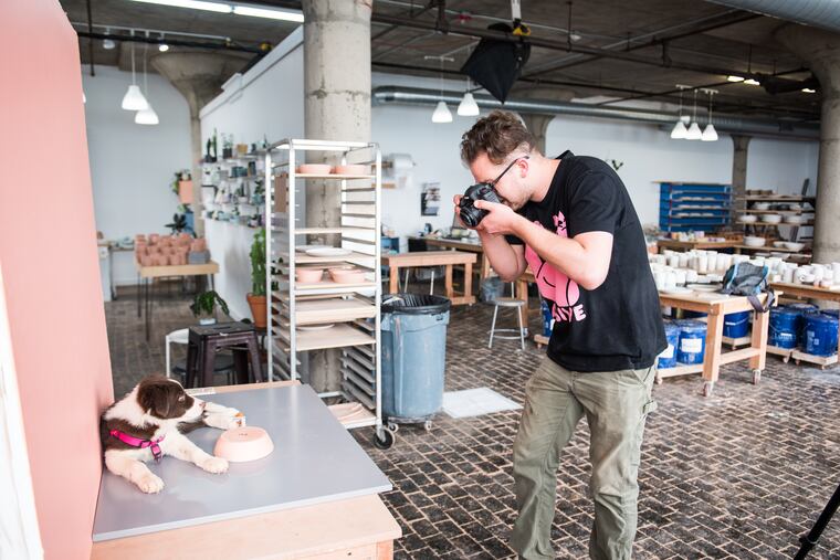 Ceramicist Brian Giniewski captures his puppy, Jelly, alongside a handcrafted doggy dish, part of a forthcoming line of petware.