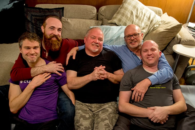 Men's Therapeutic Cuddling is a meet-up group that aims to give men a safe space to ask for help or affection. During a demonstration held for The Inquirer, members (from left) Kyle Hoffman, Scott Turner, TJ McDonnell, Kevin Eitzenberger, and Ryan Hancock pose together.