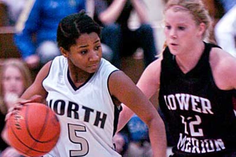 North's Devin Gold attacks the bucket against Lower Merion's Carli Swartz in the fourth quarter. (Ron Tarver/Staff Photogapher)
