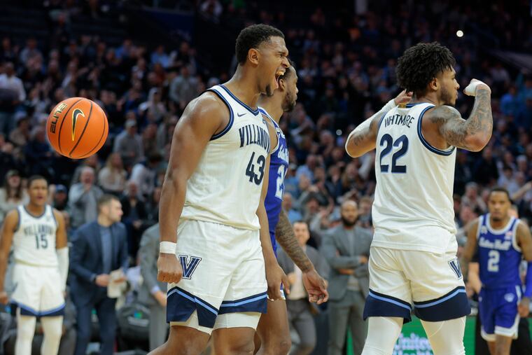 Eric Dixon (left) of Villanova celebrates after teammate Cam Whitmore scored against Seton Hall on Feb. 11.