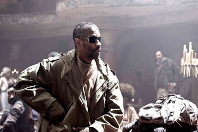 Armed and literate: Denzel Washington is inspirational as Eli, packing a precious book that sustains him on his spaghetti-western-like mission.