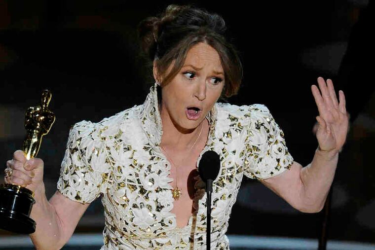 Melissa Leo accepts the supporting-actress Oscar for playing the mother of "The Fighter." Christian Bale won for his role as the brother.