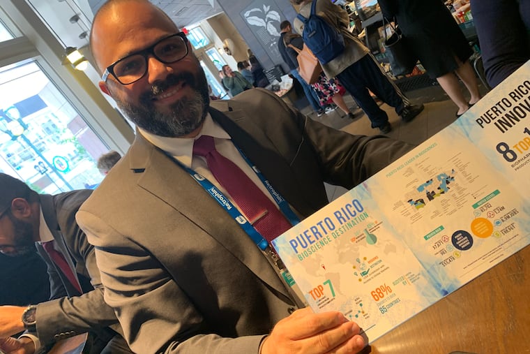 Manuel Laboy, economic development secretary for the government of Puerto Rico, shows a map of U.S.- and European-owned drug plants, which extend over half the towns in the island and employ half of its manufacturing workers. Laboy was in Philadelphia to recruit employers at the Bio 2019 conference.