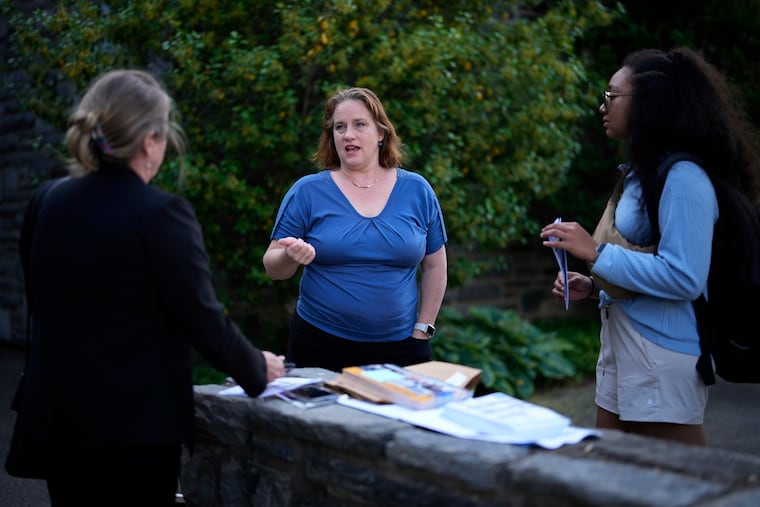 Heather Boyd (center) talks with supporters before voting at her polling place, Christ's Community Church, in Drexel Hill on Tuesday.