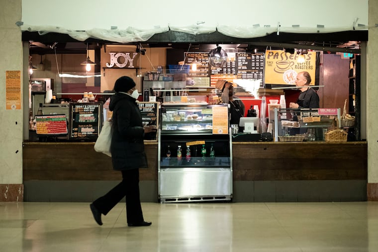 P.J. Brown and Jeff Lincoln work at Passero's at Suburban Station in Philadelphia on Monday, Dec. 19, 2022. The Passeros location in Suburban Station is closing Thursday, Dec. 22.