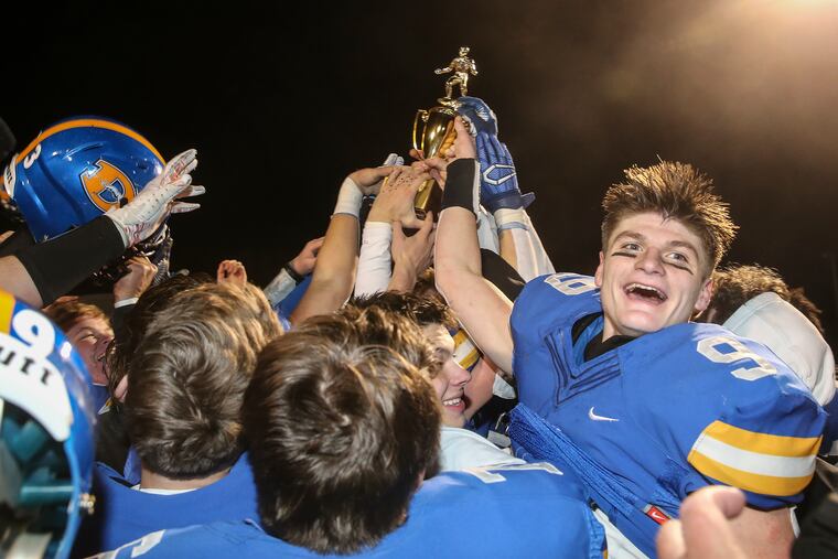 Downingtown West celebrates its 48-36 win over Coatesville in the District 1 Class 6A title game.