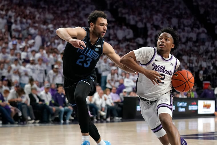 Kansas State guard Tylor Perry (2) drives under pressure from Villanova forward Tyler Burton (23) during overtime of their game on Tuesday.