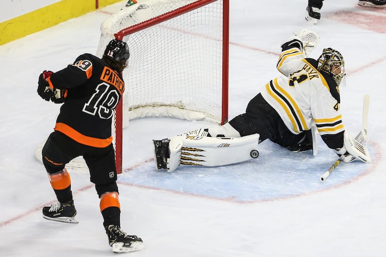 Flyers second-year center Nolan Patrick hitting the pads of Bruins goalie Jaroslav Halak during the first period of Wednesday's 4-3 win over Boston.