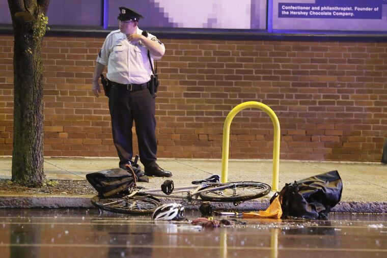 Philadelphia Police investigate the scene at 10th and Spring Garden St in Phila., Pa. where a SUV vs bicylist accident occured during the evening hours of May 12, 2018.