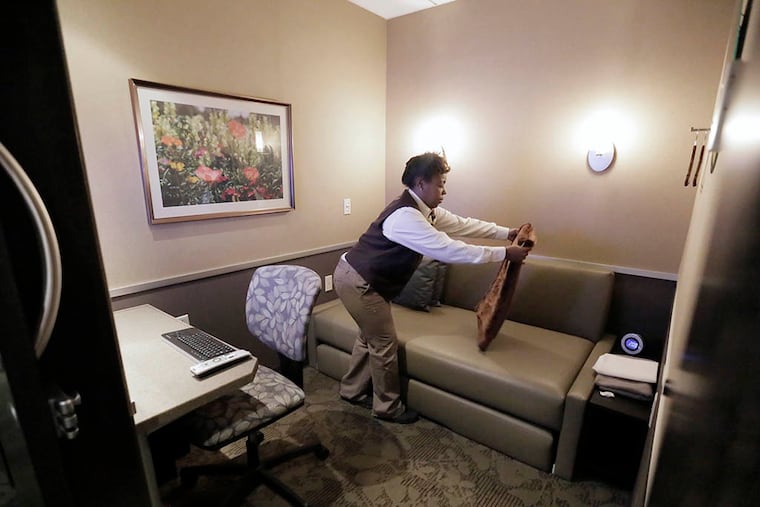 Staci Ross works at the Minute Suites micro-hotel, which is offering the breast-feeding rooms. (ELIZABETH ROBERTSON / Staff Photographer)