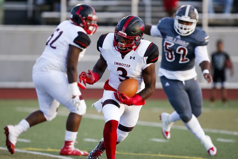 Imhotep High's Isheem Young runs with the football during the first-quarter against Gratz High on Friday, September 22, 2017.