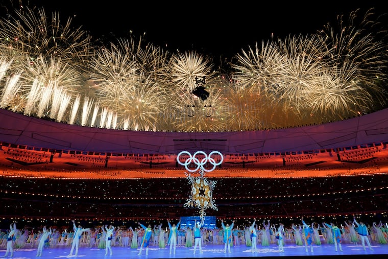 Fireworks explode over the stadium during the closing ceremony of the 2022 Winter Olympics, Sunday, Feb. 20, 2022, in Beijing.