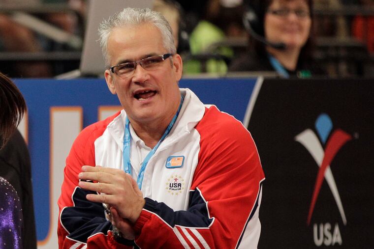 Gymnastics coach John Geddert is seen at the American Cup gymnastics meet at Madison Square Garden in New York in 2012. Prosecutors in Michigan filed charges Thursday against Geddert, a former U.S. Olympics gymnastics coach with ties to disgraced sports doctor Larry Nassar.