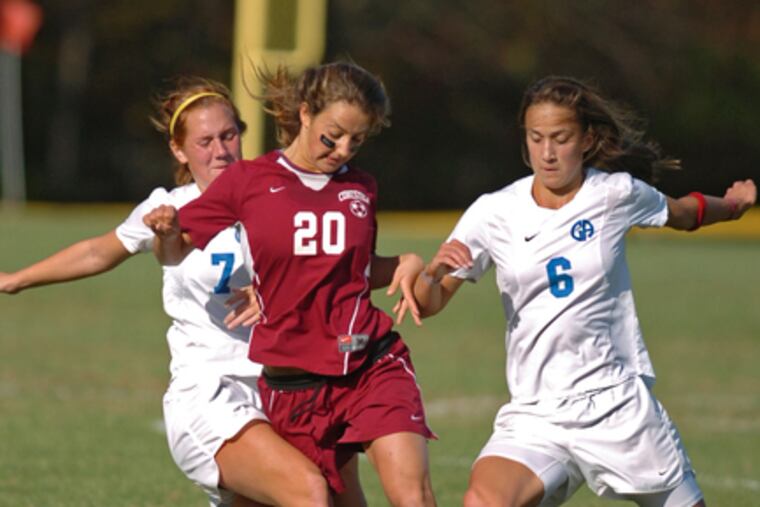 Conestoga's Rachel Renninger finds herself squeezed between Germantown Academy's Kate Henrich (left) and Jennifer Hoy. The Pioneers face Downingtown West today in a Class AAA state semifinal.