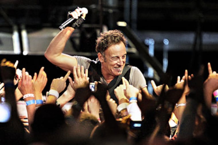Bruce Springsteen performs during the last show of his four concert stand at the Spectrum last night. ( Elizabeth Robertson / Staff Photographer )