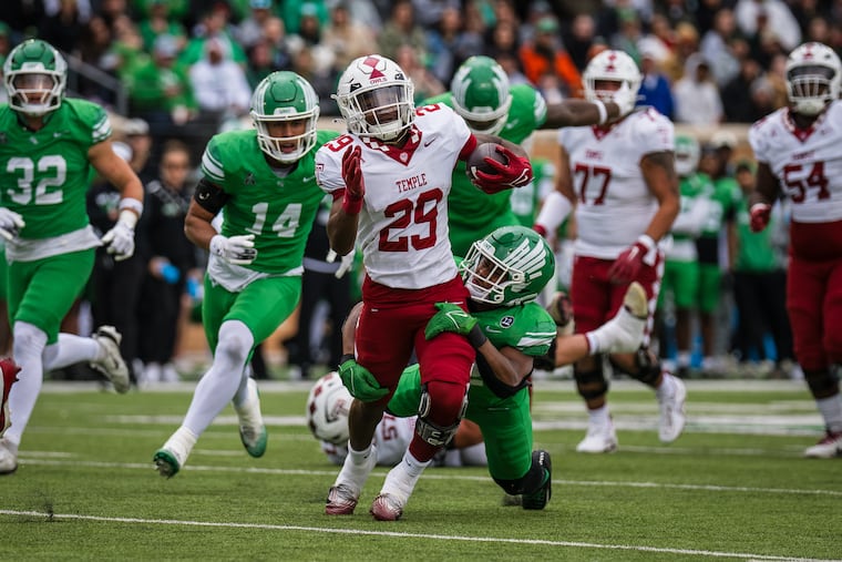 Temple running back Hunter Smith (29) is tackled by North Texas safety Patrick Smith-Young on Friday.