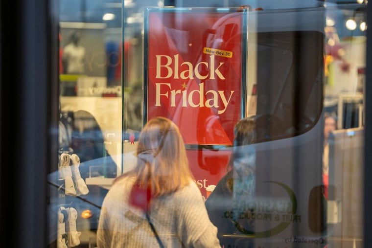 A sign displays Black Friday deals inside of a Macy’s in New Jersey last year.