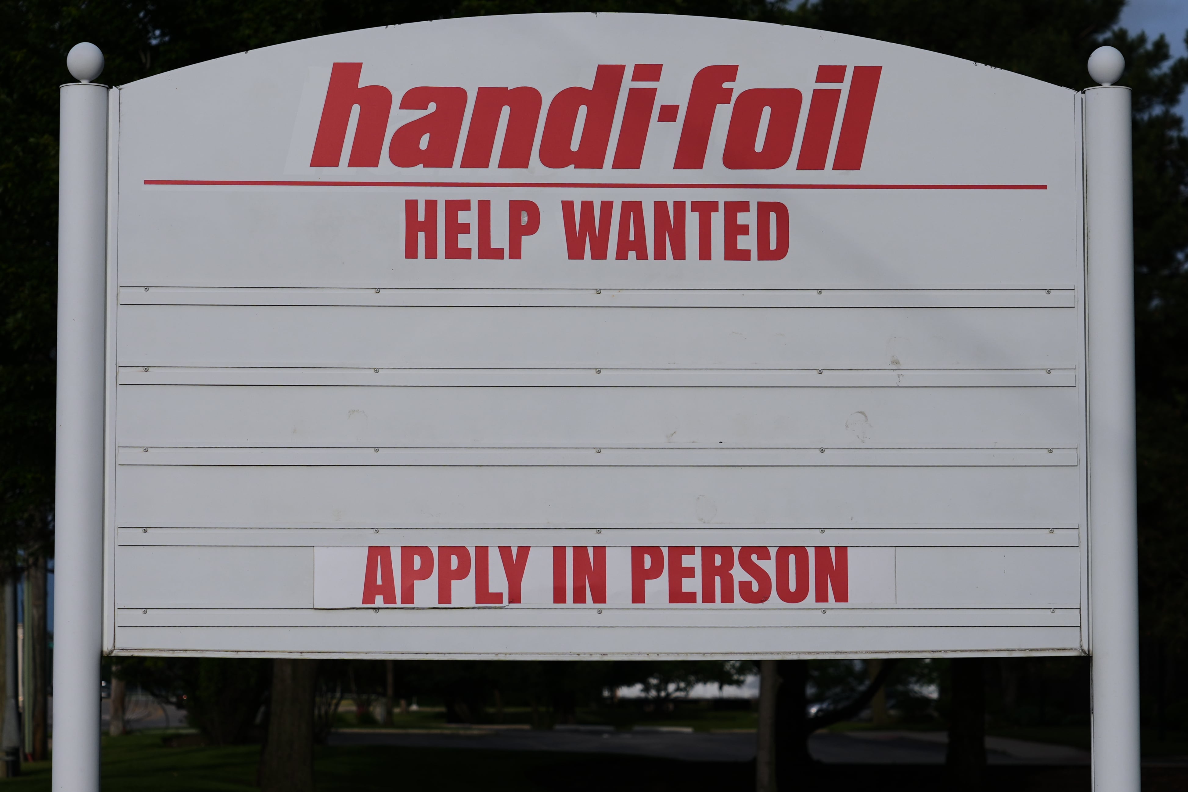 US jobless claims dip modestly to 215,000 last week as layoffs remain at historically healthy levels