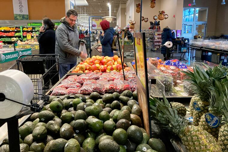 Shoppers pick out items at a grocery store in Glenview, Ill., earlier this month.