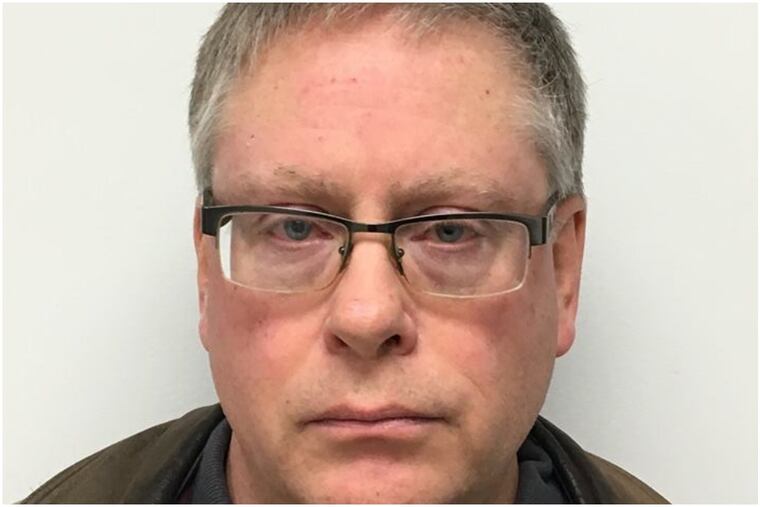 Eric Milus, 57, is accused of taking lude photos of more than 30 women without their consent.
