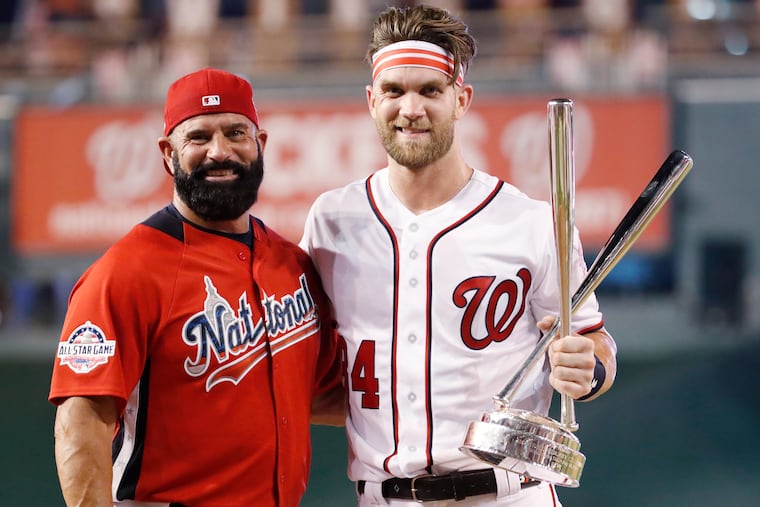Ron Harper (left) pitched to his son when Bryce Harper won the 2018 Home Run Derby with the Washington Nationals.