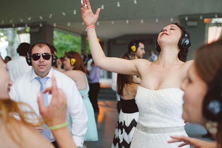 The bride wore headphones: Shelby Stamm and guests get down during silent disco at her wedding to Dan Stamm. (We Laugh We Love Photography)