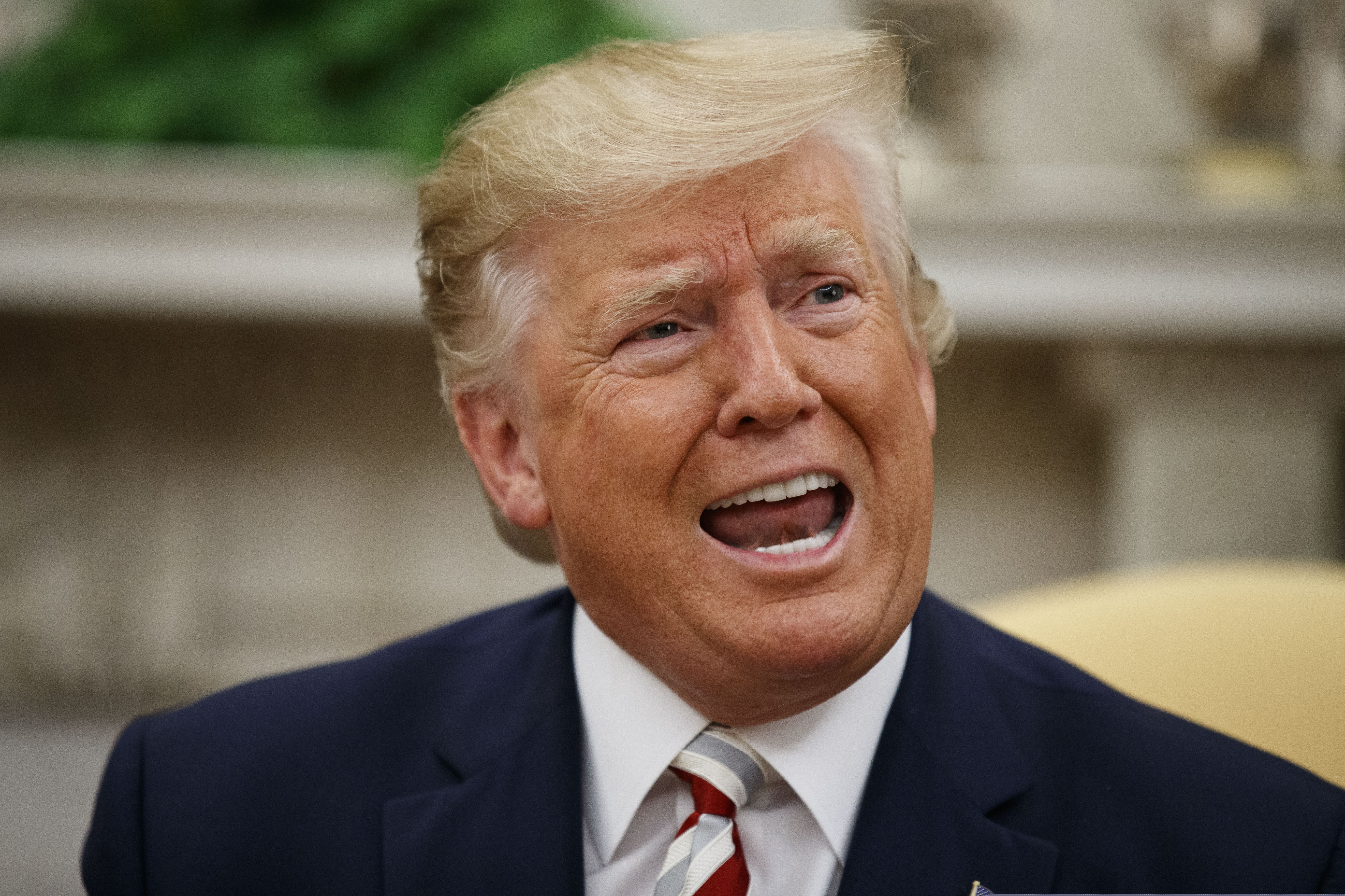 President Donald Trump speaks during a meeting with Romanian President Klaus Iohannis in the Oval Office of the White House, Tuesday, Aug. 20, 2019, in Washington.