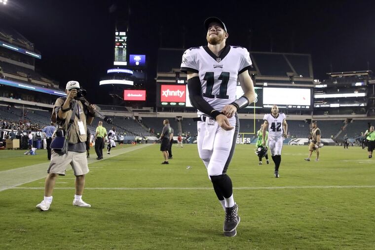 Carson Wentz runs off the field after the win over the Bills on Thursday night.