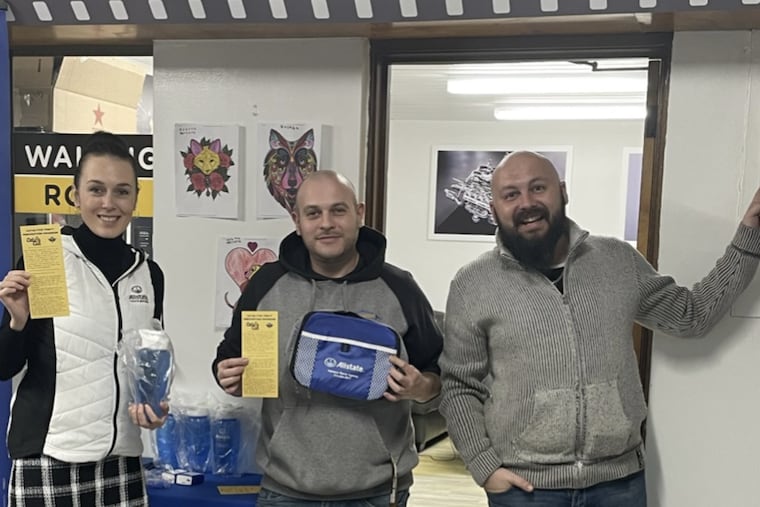 Allstate agent Tatsiana Maroz joined NE Phila Connected town watch founders Roman Krilov, left, and Roman Zhukov to promote Cat Cut, the group's program to reduce catalytic converter thefts, which have surged with the price of platinum and other metals used in the air-cleaning devices.