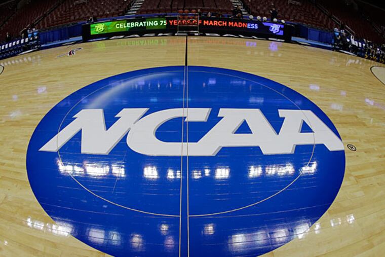 The NCAA logo is shown before Albany's practice for a second-round game of the NCAA college basketball tournament, Thursday, March 21, 2013, in Philadelphia. (Matt Slocum/AP file)