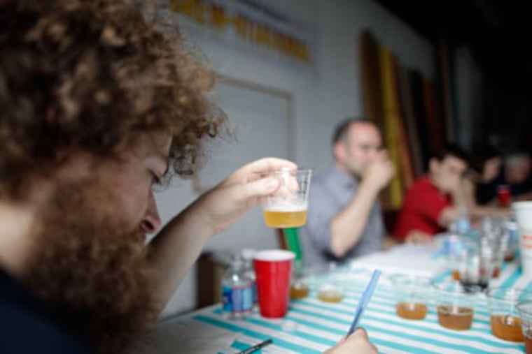 Judge Mat Falco gets into the blind tasting with gusto. (David Swanson / Staff Photographer)