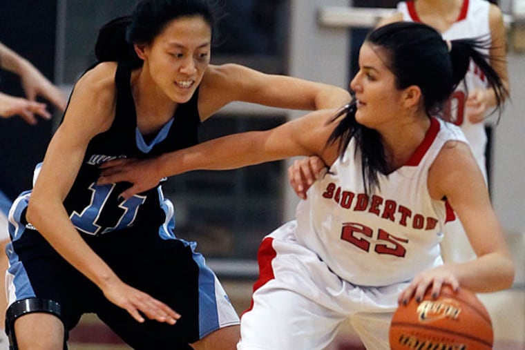 North Penn's Irisa Ye, left, plays tough defense with Souderton's Bianca Picard, right, in the third quarter. (Michael Bryant/Staff Photographer)