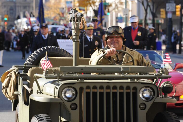 PHOTOS: CLEM MURRAY / STAFF PHOTOGRAPHER Bob Nieves drives his World War II vintage Willys jeep, which he says he found on Craigslist for $10,000, in Philadelphia's first Veterans Day Parade yesterday along Market Street in 2015.