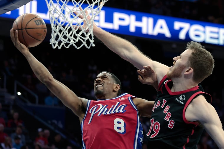 The Sixers' De'Anthony Melton goes for a layup against Toronto's Jakob Poeltl in the first quarter of their game at the Wells Fargo Center on March 31.
