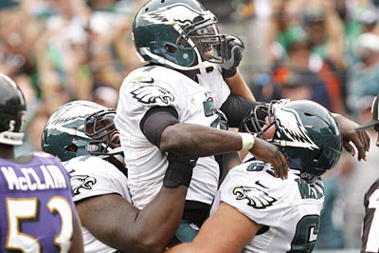Michael Vick celebrates after scoring the game-winning touchdown against the Ravens. (Ron Cortes/Staff Photographer)