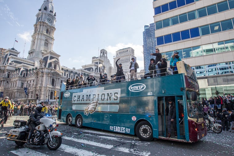 One of the buses in the 2018 Eagles Super Bowl Parade makes the turn onto JFK Boulevard, as it makes its way to the Philadelphia Museum of Art on Thursday, Feb. 8, 2018.