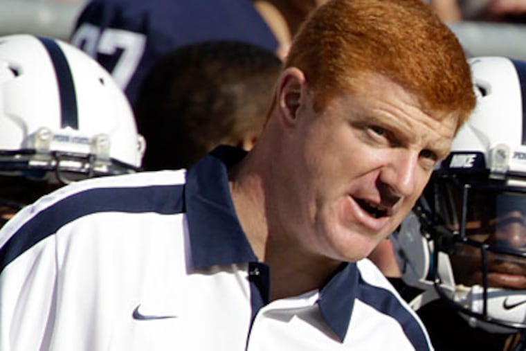 Penn State assistant coach Mike McQueary was placed on administrative leave on Friday. (Gene Puskar/AP)