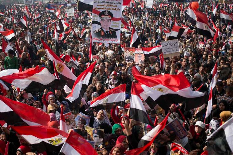 Thousands of Egyptians rally in Cairo's Tahrir Square on the third anniversary of the revolution that toppled former President Hosni Mubarak. Many carried signs backing army chief Abdel-Fattah el-Sissi.