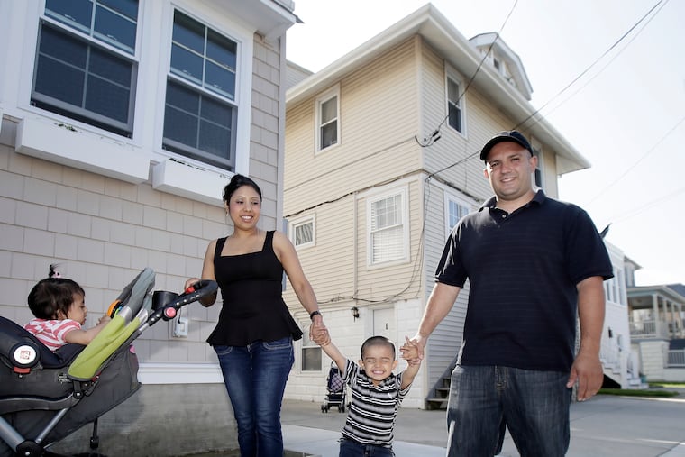 Christopher Vincente Salvatore Camino (right), wife Hilaria Zamora-Sauce, children Elizabeth Camino, 1, (left) and Christopher Camino, 2, at the family's Ventnor beach house. Camino’s grandfather Salvatore sold the house in 1991, and Chris Camino recently bought it back.