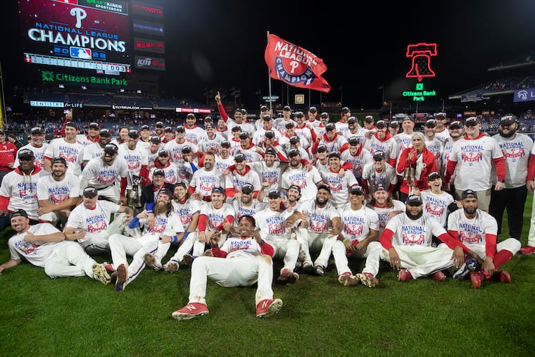 The Phillies pose for a team photo after their victory over the Padres in Game 5 of the National League Championship Series.