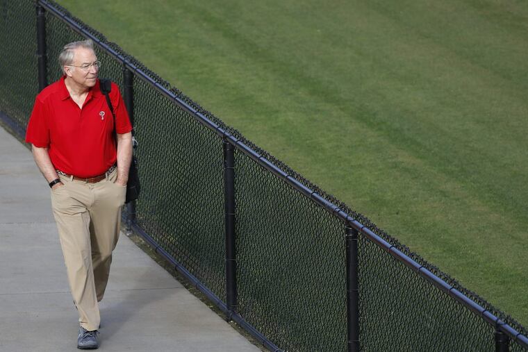 Phillies team president Andy MacPhail walks by one of the practice fields at spring training in Clearwater. DAVID MAIALETTI / Staff Photographer